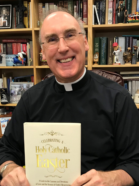 Fr. Saunders-with-new-book